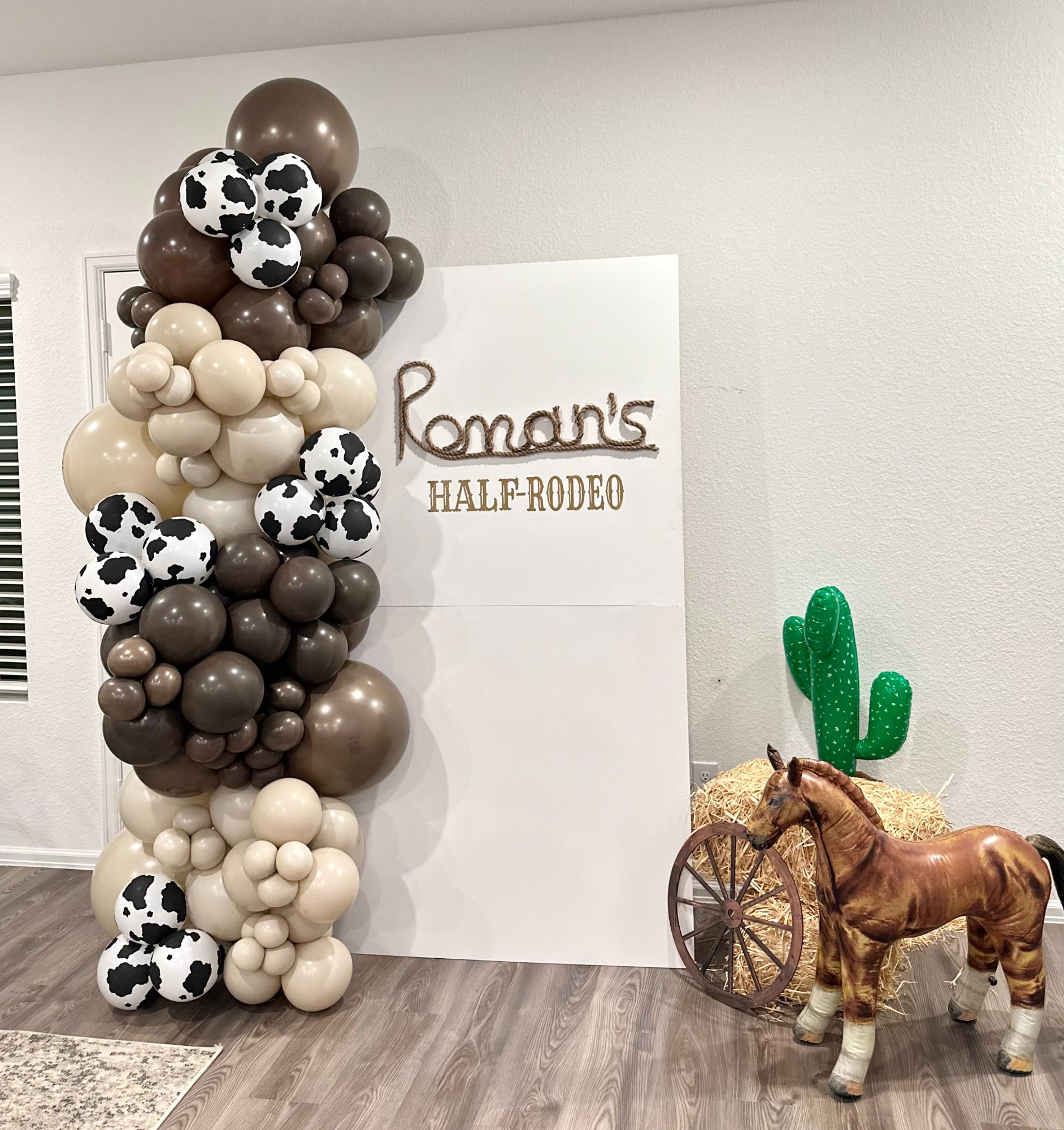 Half birthday Half Rodeo cowboy themed balloon column
